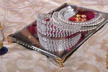diamond studded tiara or head band on a mirror tray