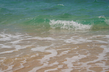 Waves and sand on the beach.
