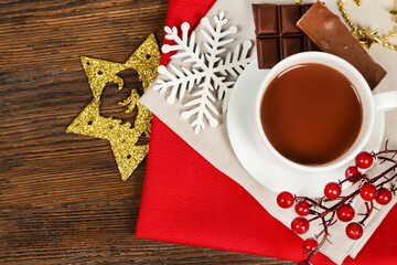 Hot chocolate in a white cup and golden decorations