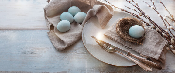 Easter breakfast still life with pussy willow on bright wood. Horizontal easter background with...