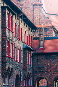 the historic Nikiszowiec housing estate. Traditional Silesian buildings. White windows with a red border