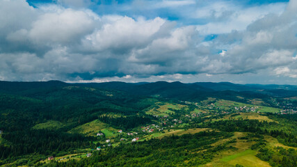 Naklejka premium mountains aerial view sky clouds