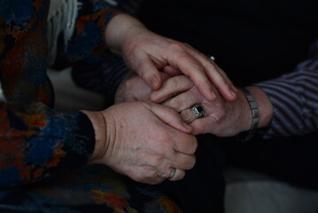 hands of the elderly person