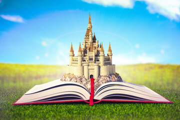 Open story book with fairy tale castle.
