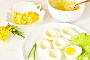 Obraz na płótnie Canvas the process of cooking stuffed eggs 
