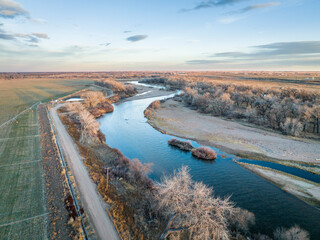 dusk over South Platte River in Colorado, aerial view with fall or winter scenery