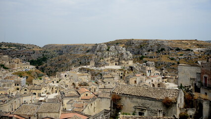 Obraz premium ITALY-Matera is a city located on a rocky outcrop in Basilicata, in Southern Italy. It includes the Sassi area, a complex of Cave Houses carved into the mountain