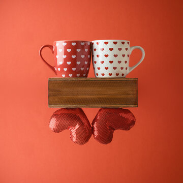 Valentines day creative concept with coffee cup and  heart shape over red background