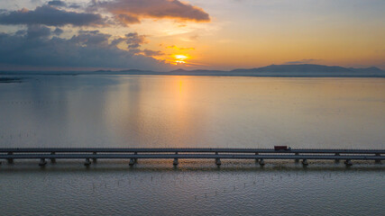 Fototapeta na wymiar Concrete bridge over the sea in the morning