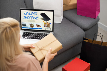 Woman using credit card with shopping online concept at home