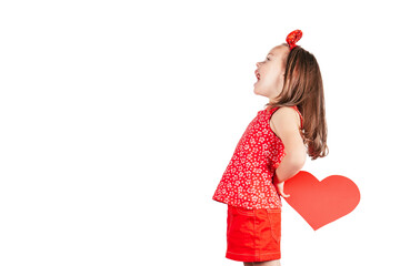 Portrait of little girl with long hair hold red paper heart in hands behind back smiling isolated on white background. Family, Valentines day, birthday, Mother's day concept. Copy space. Profile shot
