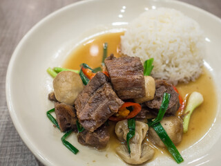 stir beef steam cook with vegetable and rice on a white dish 