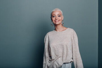 Millenial young woman with short blonde hair portrait.