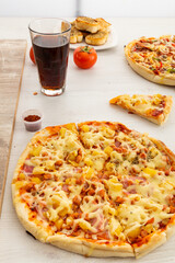 detail of wooden table with delicious fast food ready and served, lifestyle with appetizing fast food, food and drink in restaurant