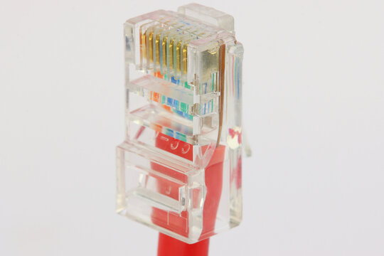 Ethernet RJ45 connector with connected colored wires close-up.