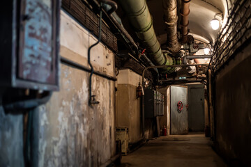 A beautiful corridor with shabby walls in an abandoned underground bunker. Old underground...