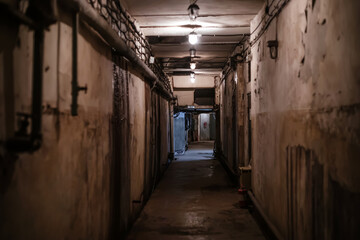 A beautiful corridor with shabby walls in an abandoned underground bunker. Old underground...