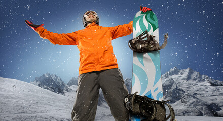 Snowboarder on a background of snowy mountains. Winter sport background. 