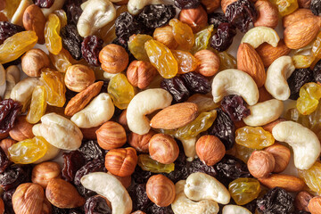 A pile of Cashews, almonds, hazelnuts and raisins