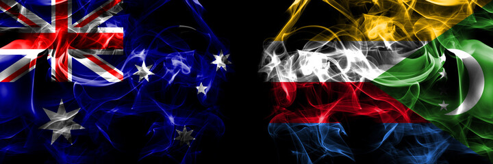 Flags of Australia, Australian vs Comoros, Comorian. Smoke flag placed side by side on black background