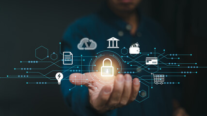 Businessman holding a security system icon For business protection, online shopping, document and big data management, finance, and banking, cloud computing Security concept with internet technology