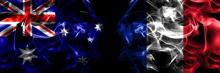 Flags of Australia, Australian vs France, French. Smoke flag placed side by side on black background