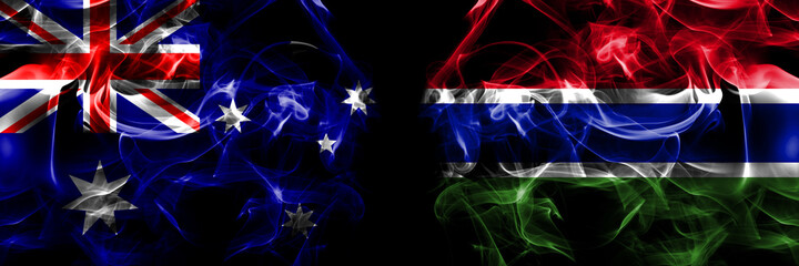 Flags of Australia, Australian vs Gambia, Gambian. Smoke flag placed side by side on black background