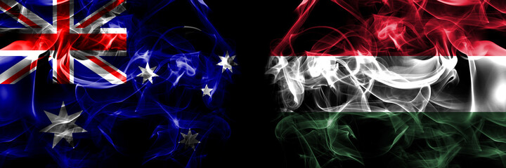 Flags of Australia, Australian vs Hungary, Hungarian. Smoke flag placed side by side on black background