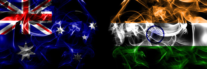 Flags of Australia, Australian vs India. Smoke flag placed side by side on black background