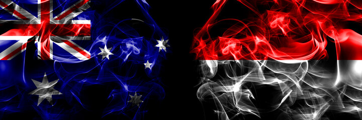 Flags of Australia, Australian vs Indonesia, Indonesian. Smoke flag placed side by side on black background