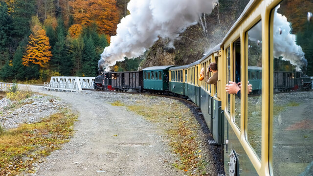Passengers taking shots of the moving steam train Mocanita from inside it, Romania