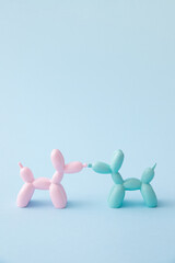 Balloon dogs in love on pastel blue background. Love card. Layout. Flat design. Minimal valentines...