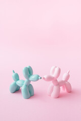 Balloon dogs in love on pastel pink background. Love card. Layout. Flat design. Minimal valentines mood concept. Couple. Pets world.