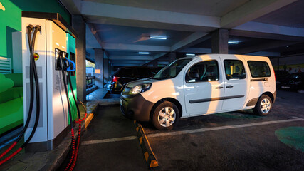 Naklejka premium Electric car charging station at a parking
