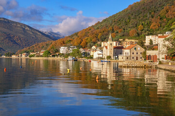Fototapeta premium Beautiful winter Mediterranean landscape. Montenegro, Adriatic Sea. View of Bay of Kotor and Donja Lastva village ( Tivat )