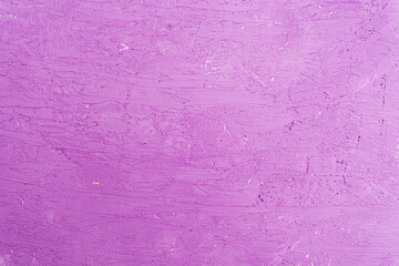 Old wall with peeling stucco. Craquelure purple textured background. Abstract concrete interior