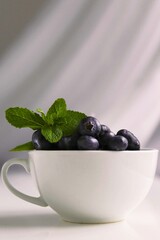 blueberries in a white cup