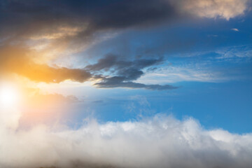 Obraz premium Fantastic fluffy clouds in the sunset sky. Sky background.