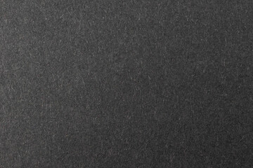 black sheet of paper with a visible texture