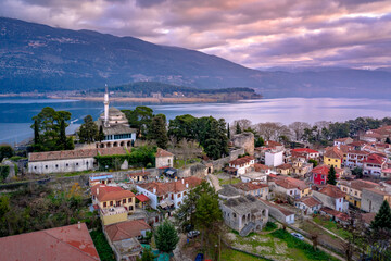 Naklejka na ściany i meble Aerial view of Ioannina city in Greece, Aslan Pasha Tzami, the lake with the island of Kyra Frosini or nissaki.