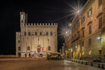 Fototapeta na wymiar Night view of Palazzo dei Consoli, the main landmark of Gubbio, Umbria, Italy