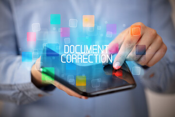 Young man holding a foldable smartphone