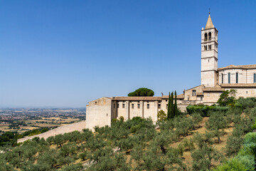 Fototapeta na wymiar Panoramic view from Assisi with the bell tower of the Basilica of Santa Chiara, Umbria, Italy