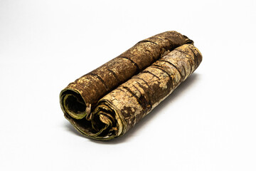 Exfoliated bark of a birch tree, resembling a scroll, isolated against white background