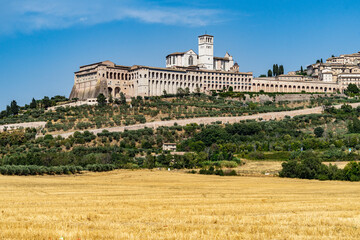 Fototapeta na wymiar View of Assisi and the Basilica of Saint Francis of Assisi complex. Assisi is one of the most important places of Christian pilgrimage in Italy