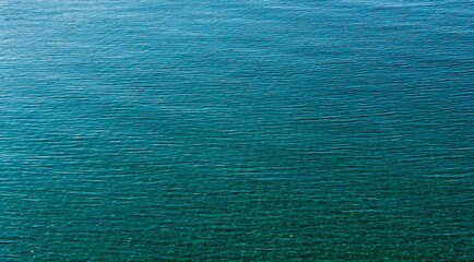 Blue water background.  Turquoise sea water surface.
