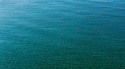 Fototapeta na wymiar Blue water background. Turquoise sea water surface.