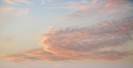 Pastel colors clouds on sunset background