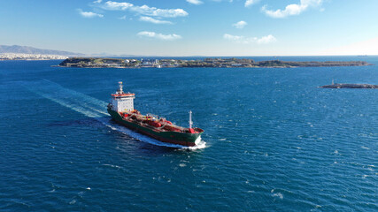 Aerial drone top view photo of oil - petrochemical tanker cruising deep blue open ocean sea