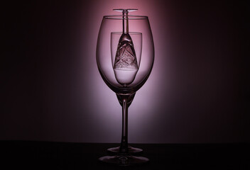 Empty wine glasses with selective focus isolated on dark background.